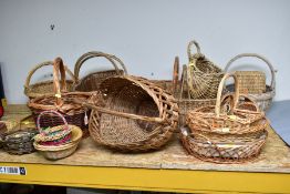 A LARGE QUANTITY OF ASSORTED WICKER BASKETS, including shopping baskets (quantity)