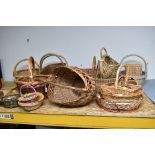 A LARGE QUANTITY OF ASSORTED WICKER BASKETS, including shopping baskets (quantity)