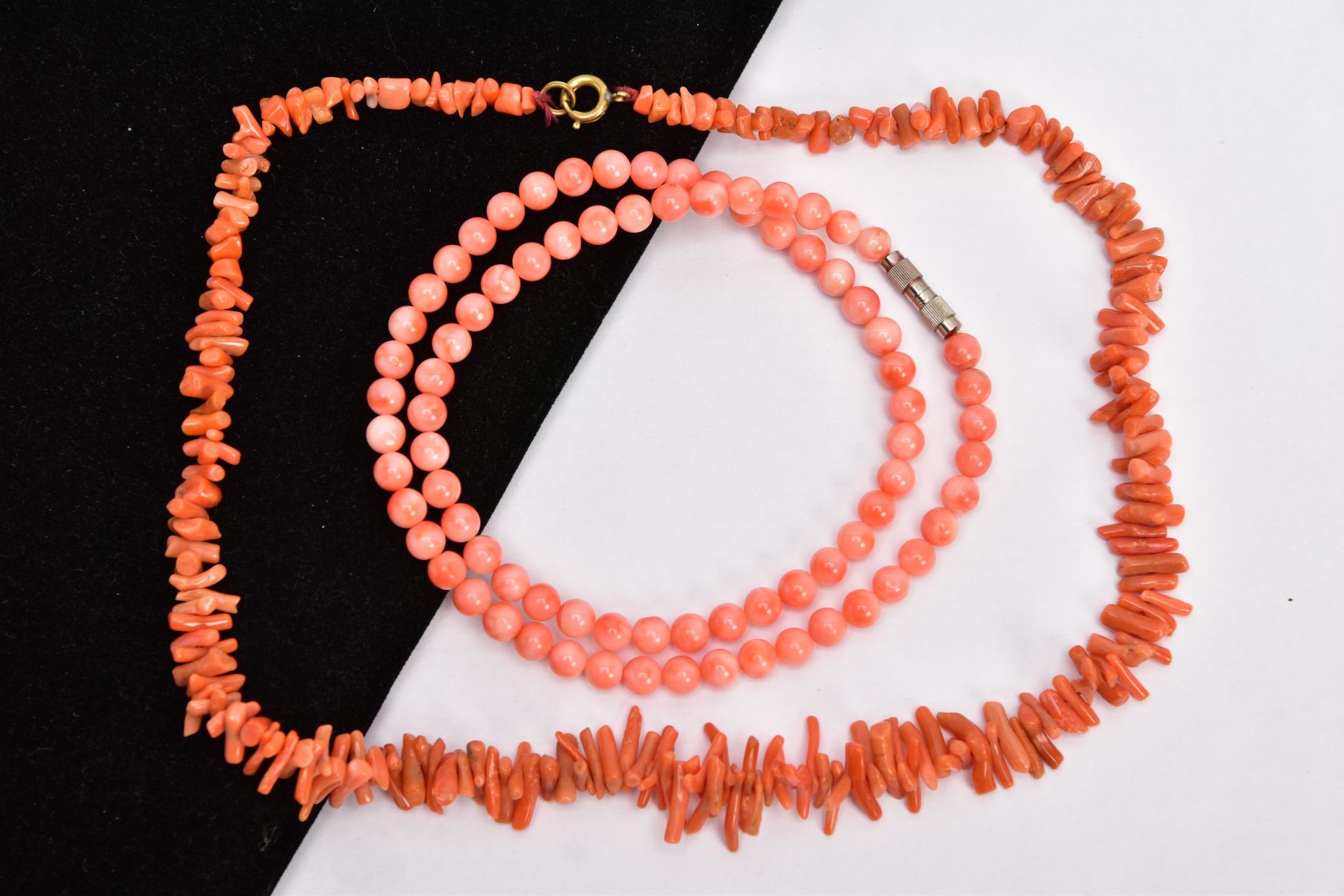 TWO CORAL NECKLACES, the first a polished pink coral bead necklace, each bead measuring