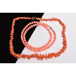 TWO CORAL NECKLACES, the first a polished pink coral bead necklace, each bead measuring