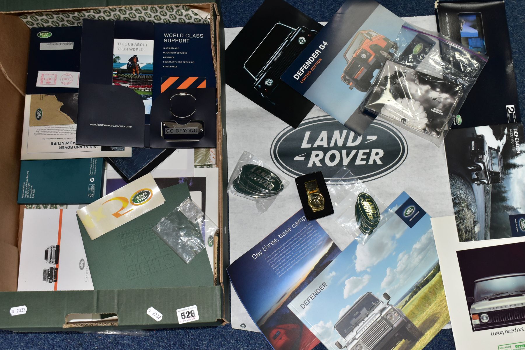 A TRAY OF LANDROVER ADVETISING EPHEMERA, ETC, to include Defender sales brochures, twelve '