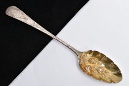 A GEORGE III SILVER BERRY SPOON, fruit and foliate gilt embossed bowl, floral engraved handle with a