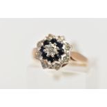 A 9CT GOLD SAPPHIRE AND DIAMOND CLUSTER RING, of tiered design, set with a central single cut