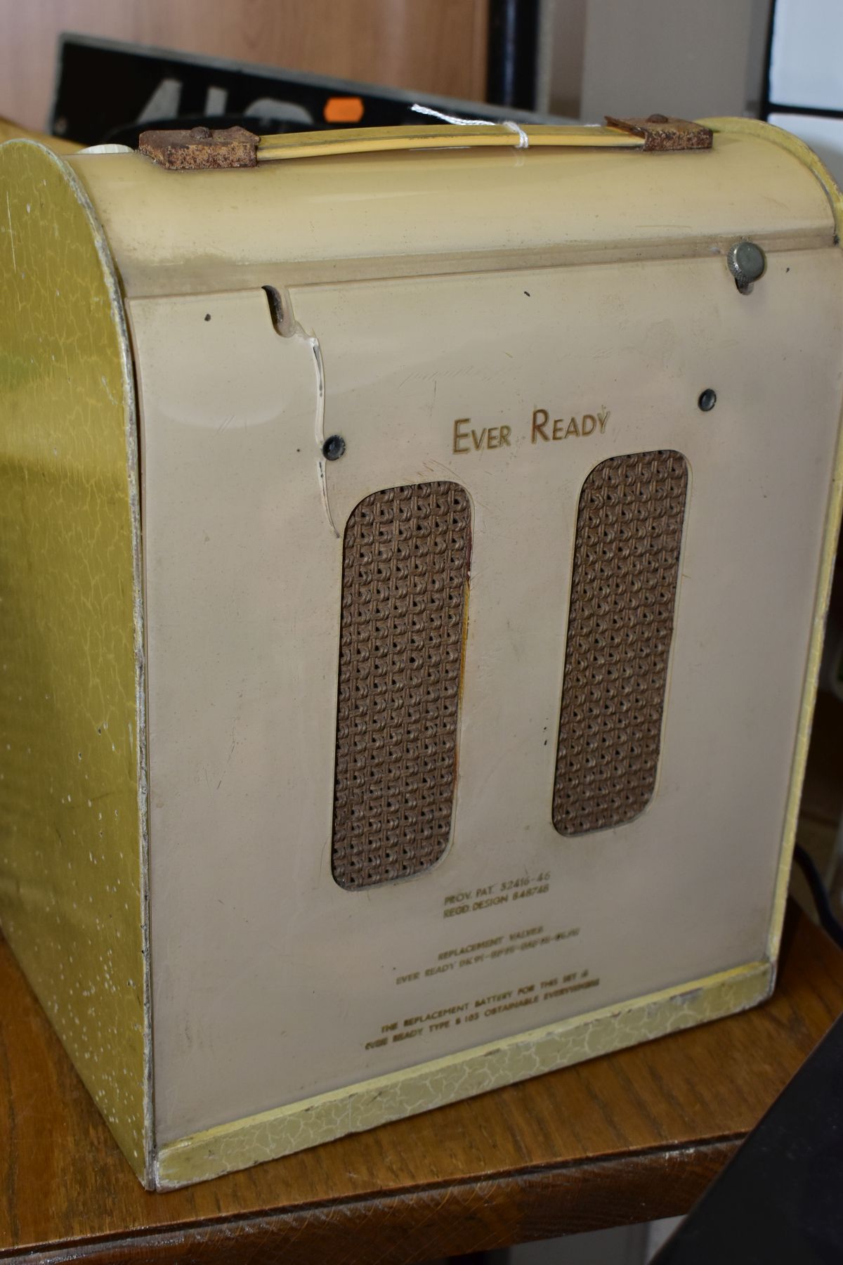 A VINTAGE EVER READY CREAM PLASTIC AND WOODEN CASED RADIO, reg.design 848748, woodworm to sides of - Image 6 of 6