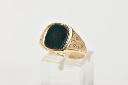 A GENTS 9CT GOLD SIGNET RING, designed with a rounded bloodstone, floral engraved shoulders,