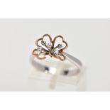 A 9CT WHITE GOLD DRESS RING, of flower design with four open heart shape rose gold petals and five