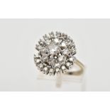 A MODERN DIAMOND CLUSTER RING, centring on a modern round brilliant diamond, estimated weight 0.