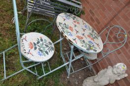 A MODERN FOLDING ROUND GARDEN TABLE AND TWO MATCHING CHAIRS with steel frames, ceramic seats and top