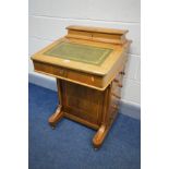 A 19TH CENTURY WALNUT AND INLAID DAVENPORT, a stationery compartment above a lid enclosing four