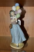 A LLADRO FIGURE 5141 'Balloon Seller', designed by Vincente Martinez, issued 1982-1996, height