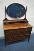 AN EDWARDIAN MAHOGANY AND STRING INLAID DRESSING CHEST, with an oval swing mirror, and two over