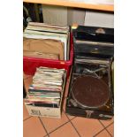A VINTAGE HMV PORTABLE GRAMOPHONE IN DISTRESSED CONDITION AND TWO BOXES OF RECORDS, including