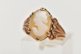 A 9CT GOLD CAMEO RING, the oval cameo depicting a lady in profile, to the tapered scroll design