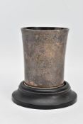 AN EARLY VICTORIAN SILVER BEAKER WITH COASTER, plain polished tapered beaker, stepped rim to the