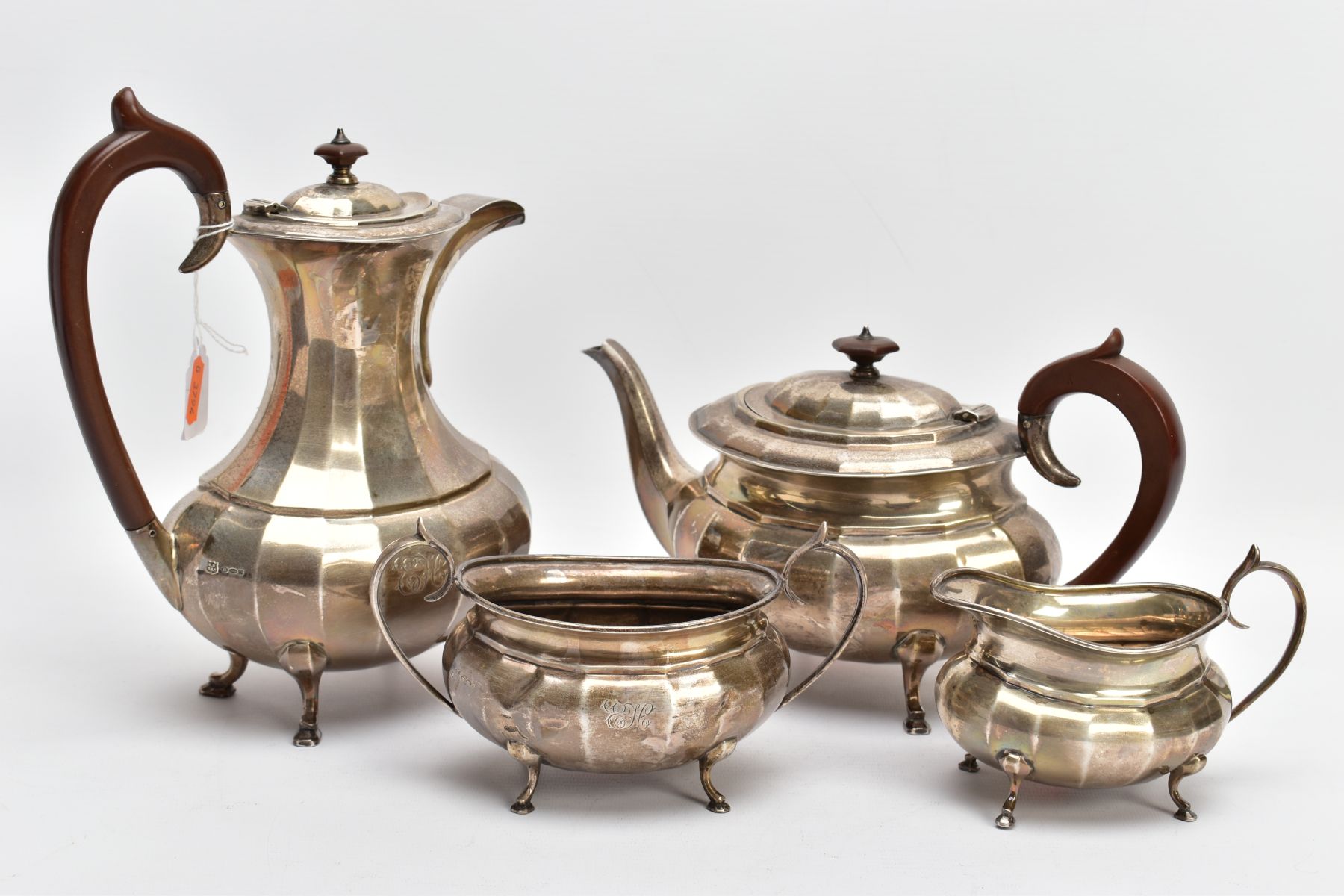 A FOUR PIECE GEORGE.V SILVER TEA SET, to include a teapot and hot water jug each of a faceted George - Image 8 of 8