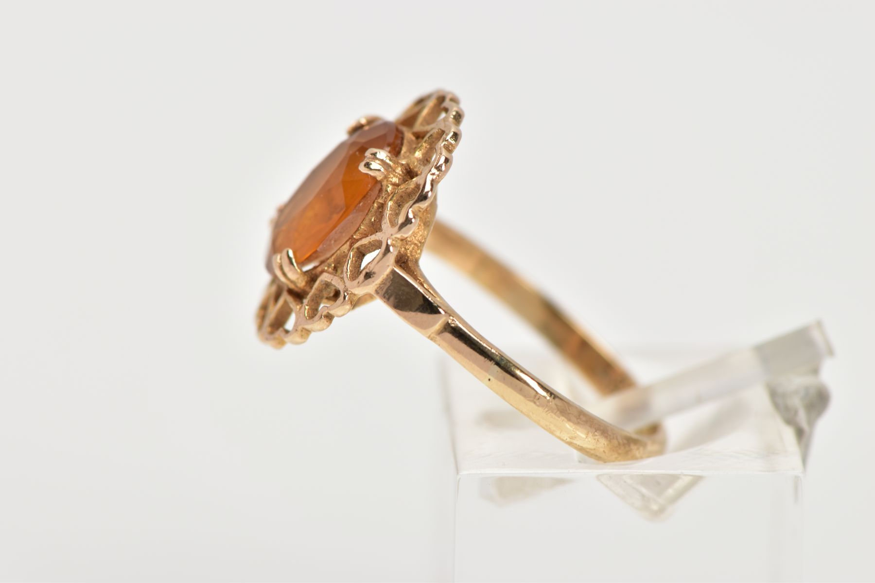 A YELLOW METAL CITRINE RING, designed with a claw set oval cut citrine, within an openwork heart - Image 2 of 4