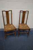 IN THE MANNER OF WILLAM R LETHABY, a pair of oak Arts and Crafts splat back chairs with rush drop in