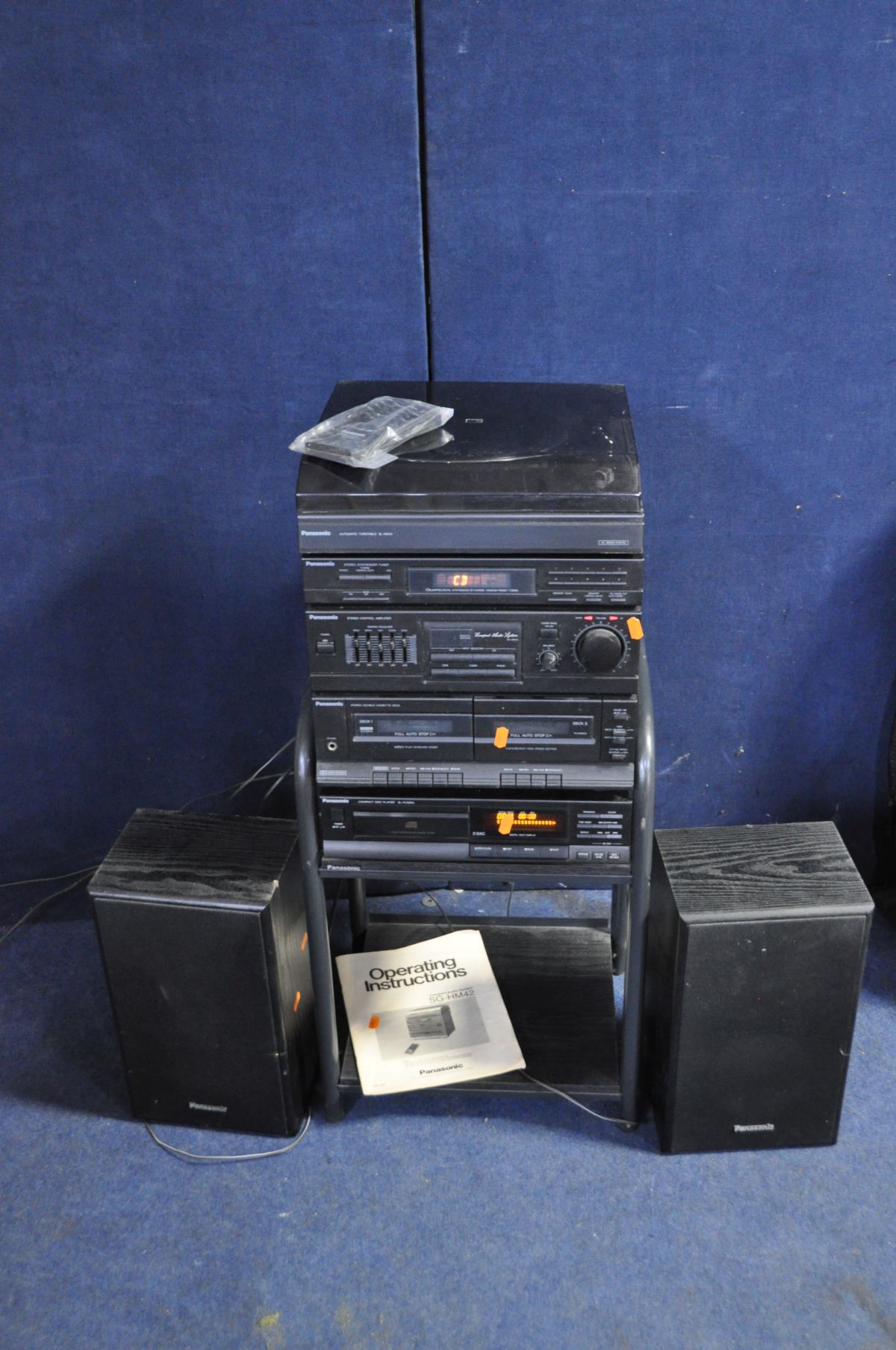 A PANASONIC SG-HM42 HI FI with remote and matching speakers and a SL-PJ325A CD player on a black ash