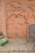 THREE DECORATIVE WROUGHT IRON GARDEN ITEMS with hooped tops finished at scrolled detail one 135cm