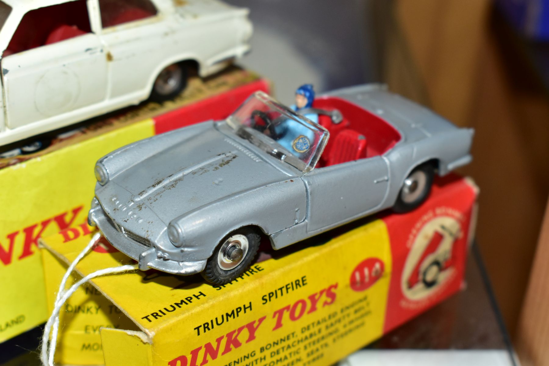 THREE BOXED DINKY TOYS CARS, Truimph Spitfire, No 114 metallic silver grey body, red interior, - Image 2 of 9
