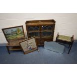 AN EARLY 20TH CENTURY OAK BOOKCASE with astragal glazed double cupboard doors and silver