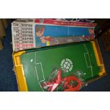 A VINTAGE IDEAL CROSSFIRE GAME with four shooters and ball bearing, target is missing, box tatty,