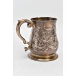 A SILVER GEORGE II MUG, of baluster form with a scroll handle, later embossed and chased floral