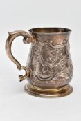 A SILVER GEORGE II MUG, of baluster form with a scroll handle, later embossed and chased floral