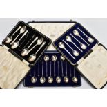 THREE CASED SETS OF SILVER SPOONS, to include a twelve-piece coffee spoon set, each with a wooden