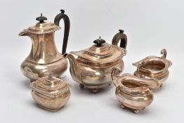 A SILVER FIVE-PIECE TEA SET, to include a teapot and hot water jug each with a wooden scroll