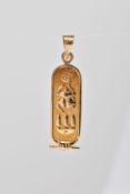 A YELLOW METAL HIEROGLYPHIC PENDANT, fitted with a tapered bail, stamped Egyptian control mark,