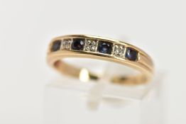 A 9CT GOLD SEVEN STONE SAPPHIRE AND DIAMOND RING, the line of four circular cut sapphires