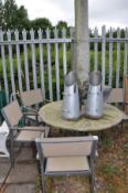 A ROUND HARDWOOD TOPPED GARDEN TABLE 120cm in diameter, with a tubular metal frame, four chairs,