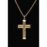 A YELLOW METAL CROSS PENDANT NECKLACE, textured hollow cross pendant, fitted with an oval suspension