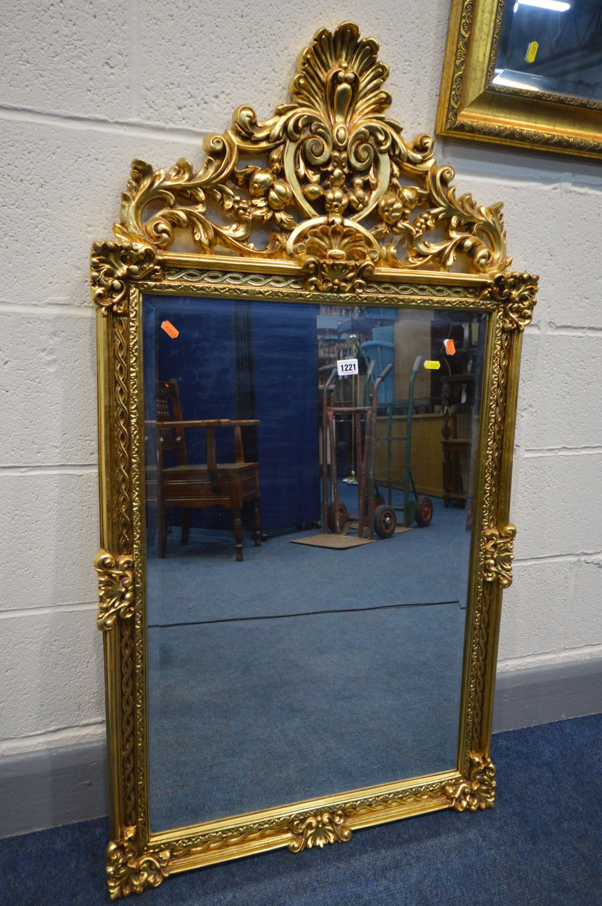 A GILT ON RESIN BEVELLED EDGE WALL MIRROR with open foliate, 67cm x 124cm, together with a - Image 2 of 4