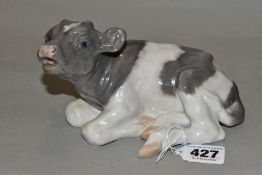 A ROYAL COPENHAGEN FIGURE OF A RECUMBENT CALF, model no 1072, printed and painted green and blue