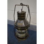 A BRASS SHIPS HEAD LANTERN, c1919, label reading Anchor light No 1235, Great Britain