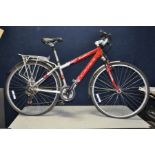 A CARRERA CROSSFIRE 1000 MOUNTAIN BIKE with front suspension, 21 speed twist grip gears, front and