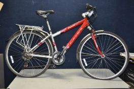 A CARRERA CROSSFIRE 1000 MOUNTAIN BIKE with front suspension, 21 speed twist grip gears, front and