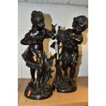 A PAIR OF VICTORIAN STYLE BRONZES OF A SMALL BOY AND GIRL, the girl with a small bird perched on her