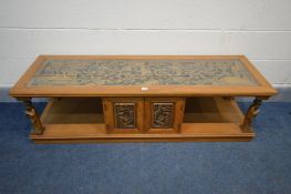 AN ORIENTAL HARDWOOD COFFEE TABLE, the glass insert enclosing heavily carved chinoiserie decoration,