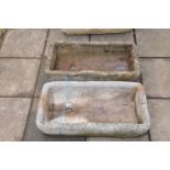 TWO COMPOSITE TROUGHS, very similar in design width 69cm depth 36cm height 16cm (2)