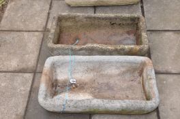 TWO COMPOSITE TROUGHS, very similar in design width 69cm depth 36cm height 16cm (2)