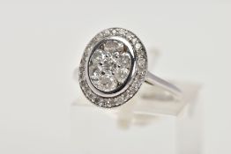 A MODERN 9CT WHITE GOLD DIAMOND OVAL CLUSTER RING, estimated total modern round brilliant cut weight