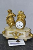 A MID 19TH CENTURY FRENCH GILT METAL AND ALABASTER FIGURAL MANTEL CLOCK, cast with a girl holding