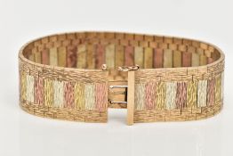 A WIDE 9CT TRI-COLOURED FLAT LINK BRACELET, a textured yellow, white and rose gold flat