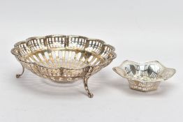 TWO EARLY 20TH CENTURY SILVER DISHES, the first a small trinket dish with pierced detail and waved