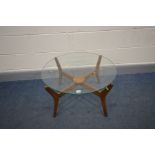 A DANISH STYLE TEAK CIRCULAR GLASS TOP COFFEE TABLE, on four shaped legs united by a small