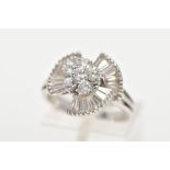 A MODERN DIAMOND FANCY RING, centring on a cluster of round brilliant cut diamonds, enclosed