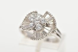 A MODERN DIAMOND FANCY RING, centring on a cluster of round brilliant cut diamonds, enclosed